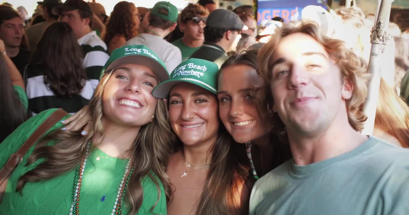 Four friends smiling together at The Cabana on Irish Day